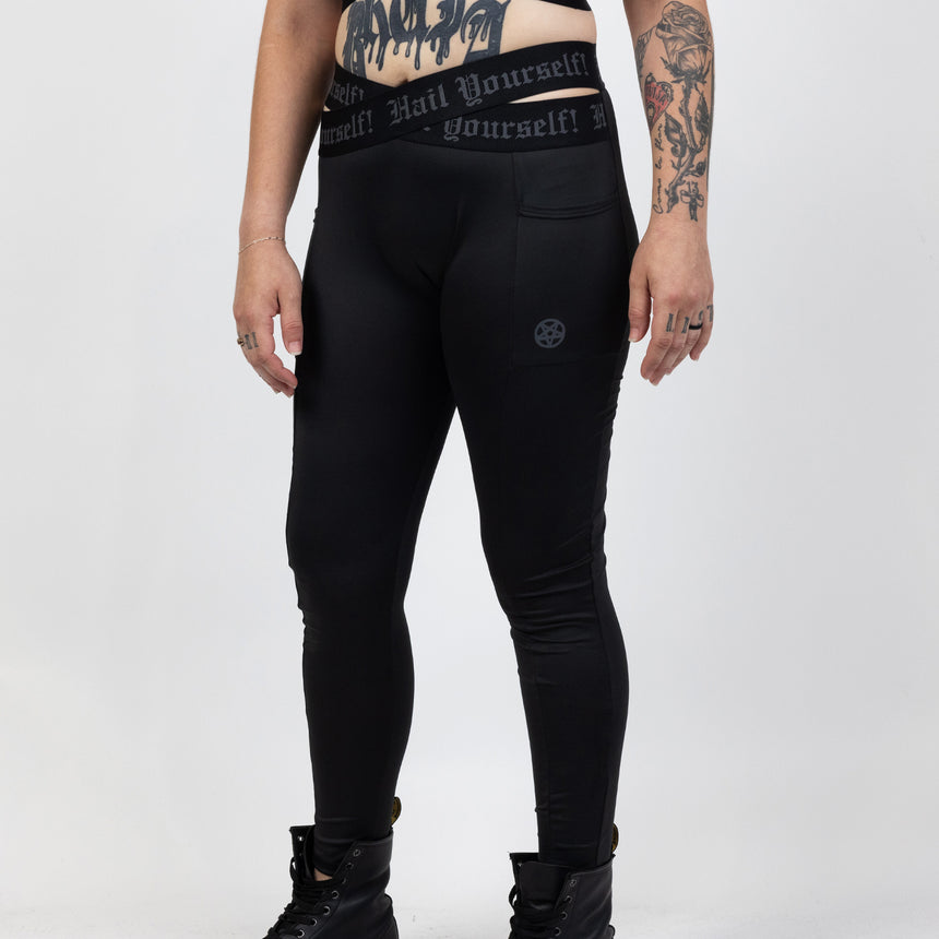 High waisted crossover legging with "Hail Yourself!" text on waistband