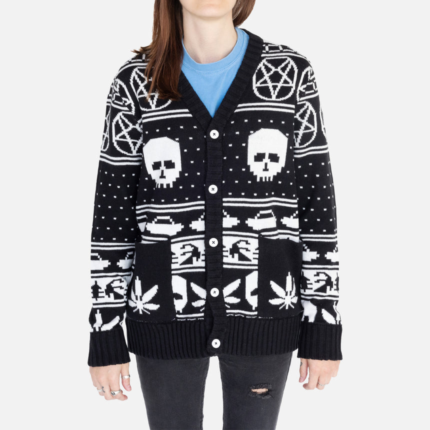 Black and white Holiday cardigan with skulls and pentagrams laid flat