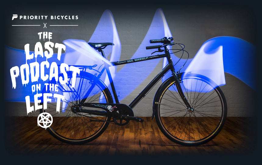 Black LPOTL dark rider cruiser with text on image "PRIORITY BICYCLES X THE LASTPODCAST ON THE LEFT"