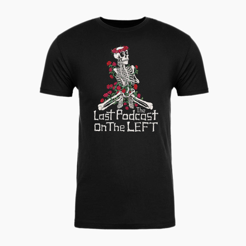 Black shirt with Skeleton covered in roses and text below "The Last Podcast On The Left"