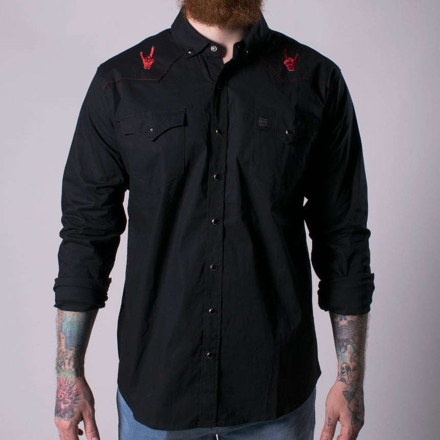 long sleeve black buttondown shirt with red hands on shoulders making horn sign