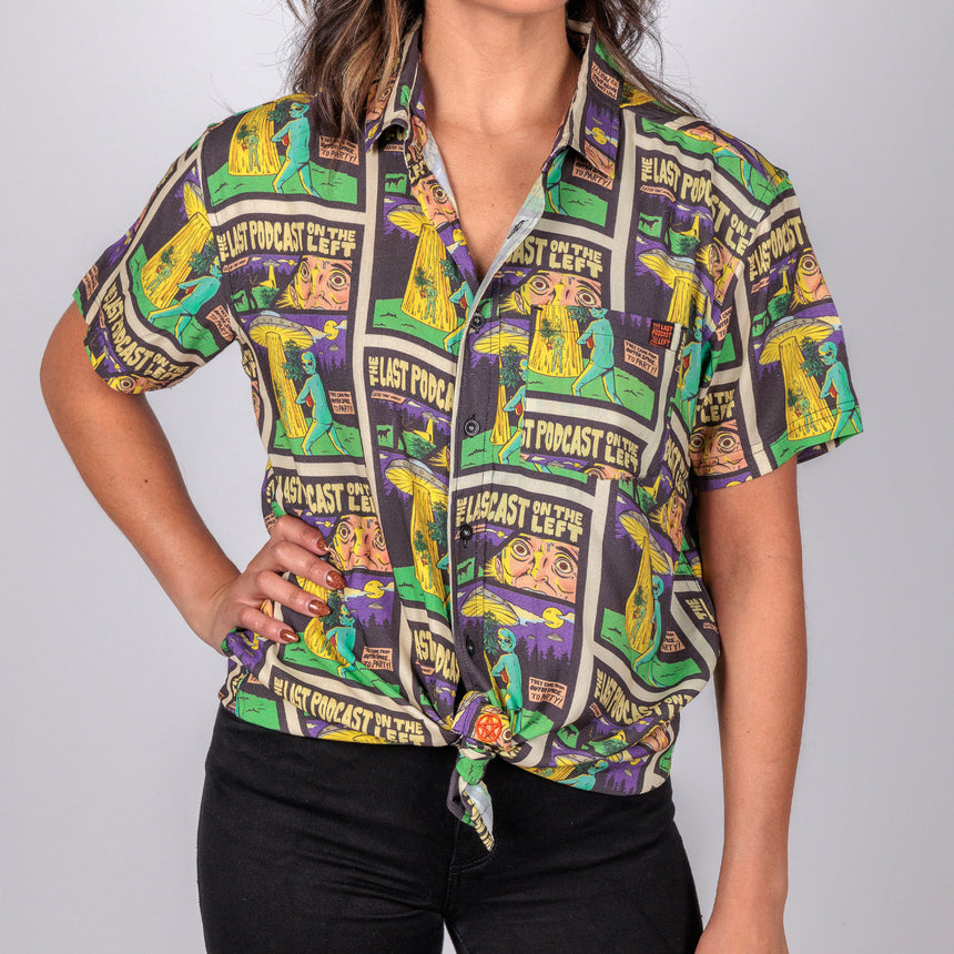 photo of female model wearing party time short sleeve button down. comic book background with alien and spaceship