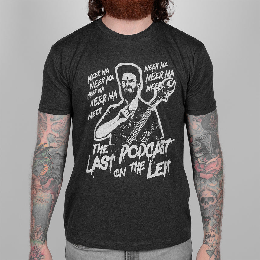 Woman in Charcoal tee with white graphic of man playing guitar and text "NEER NA NEER NA NEERA THE LAST PODCAST ON THE LEFT"