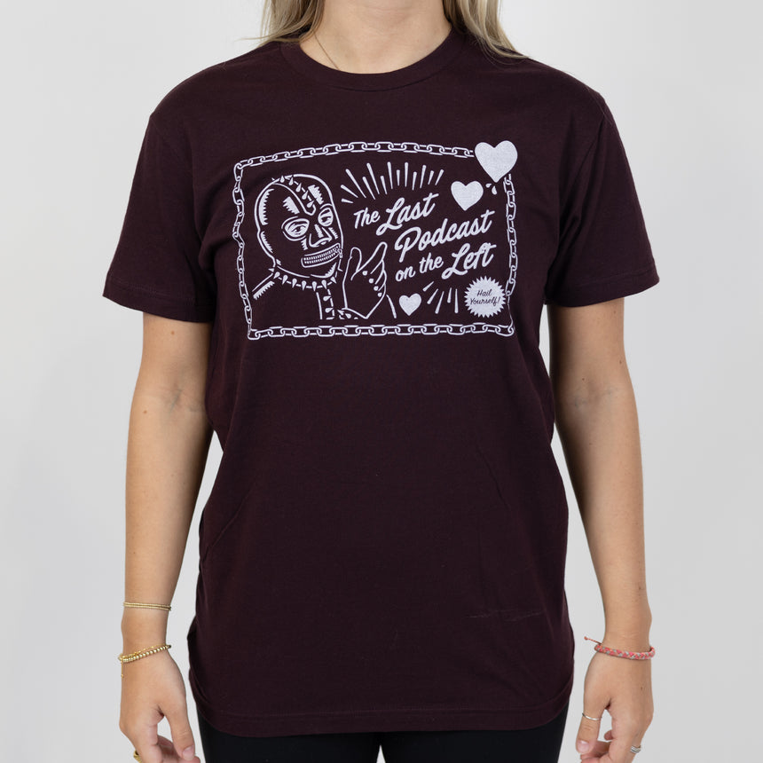 Oatmeal tee with graphic of pagan skull with text "LPOTL THE LAST PODCAST ON THE LEFT"