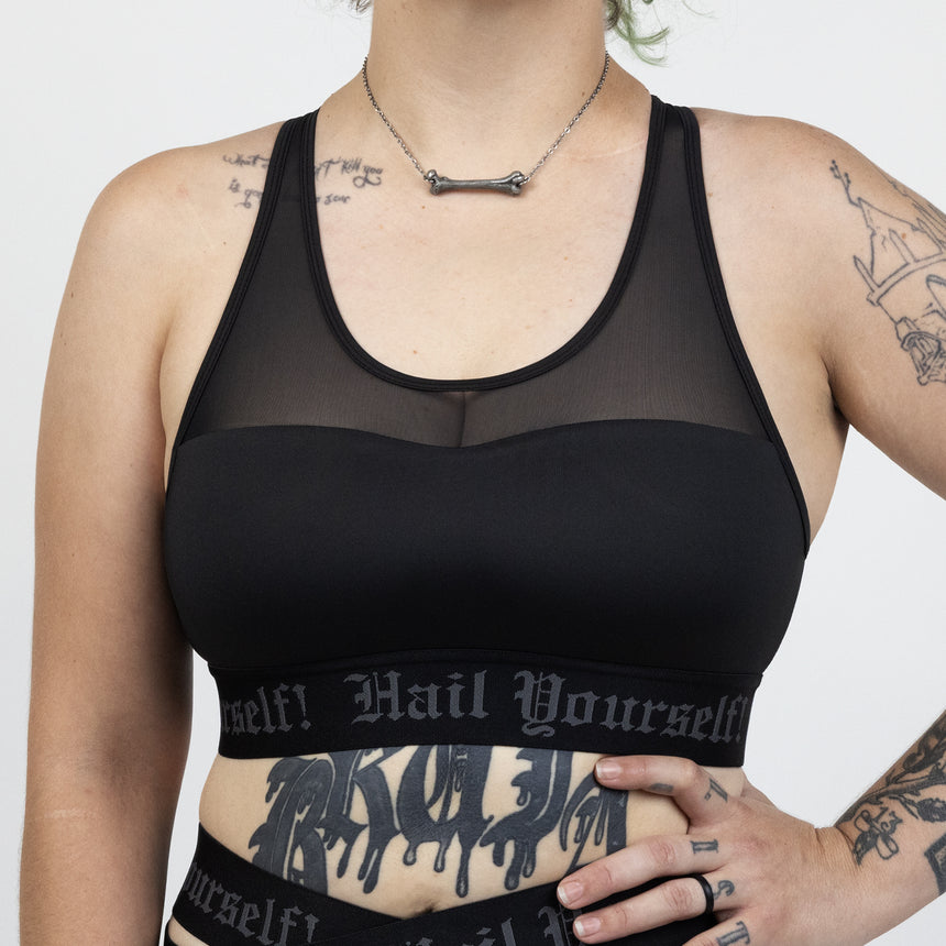 Front view of ladies High Neck Sports Bra with "Hail Yourself!" Text on bottom band