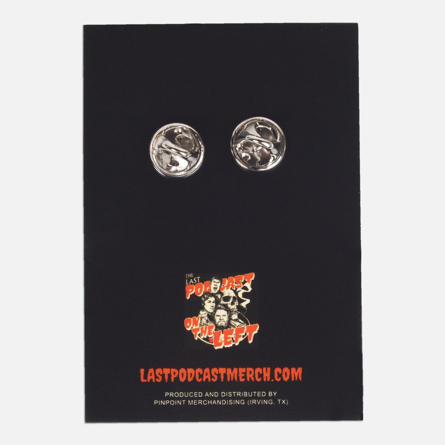 back of pin on paper showing 2 pin fasteners