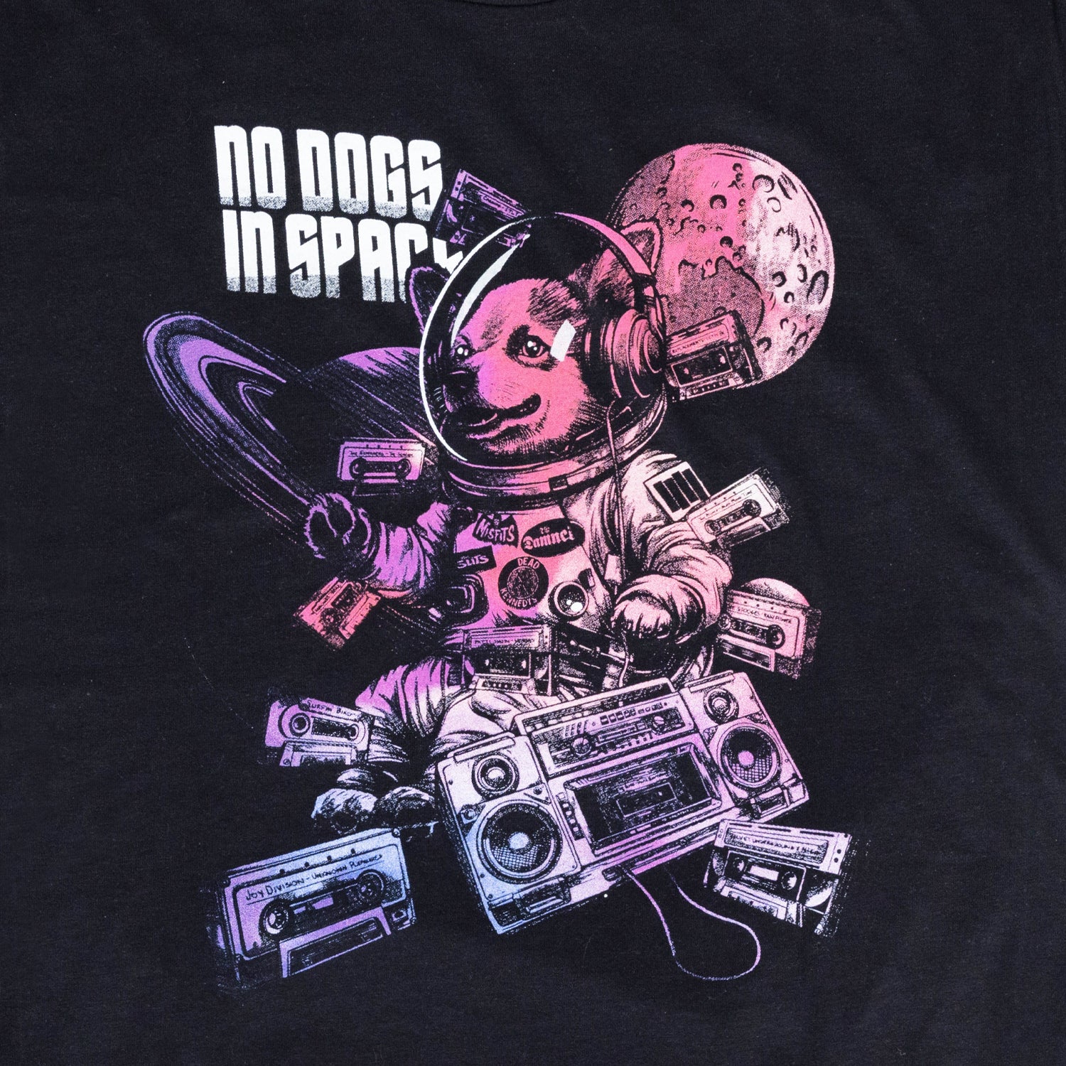 closeup of graphic on black shirt with text "NO DOGS IN SPACE" with graphic of dog in space suit with boombox