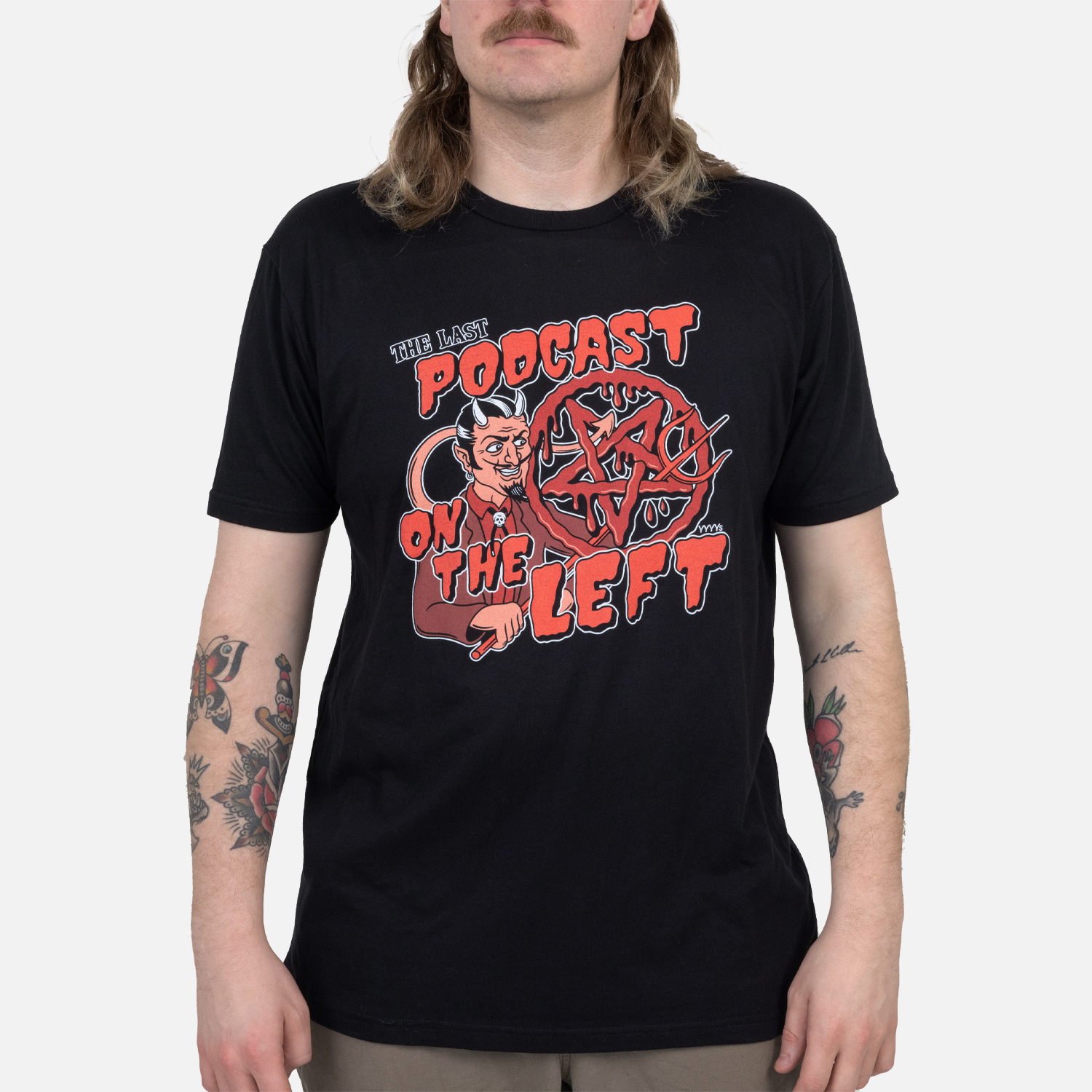 Black tee with graphic of devil and pentagram with text "THE LAST PODCAST ON THE LEFT" on male model