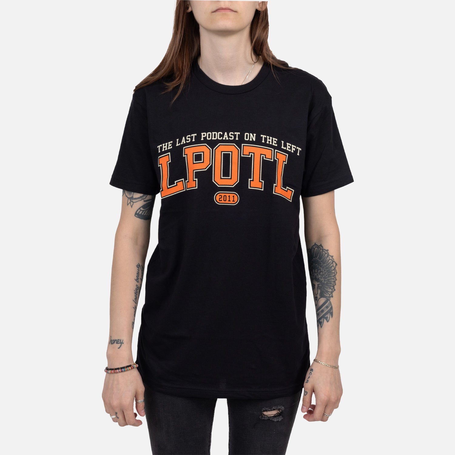 Female model wearing Black Collegiate style tee with text "THE LAST PODCAST ON THE LEFT LPOTL 2011"