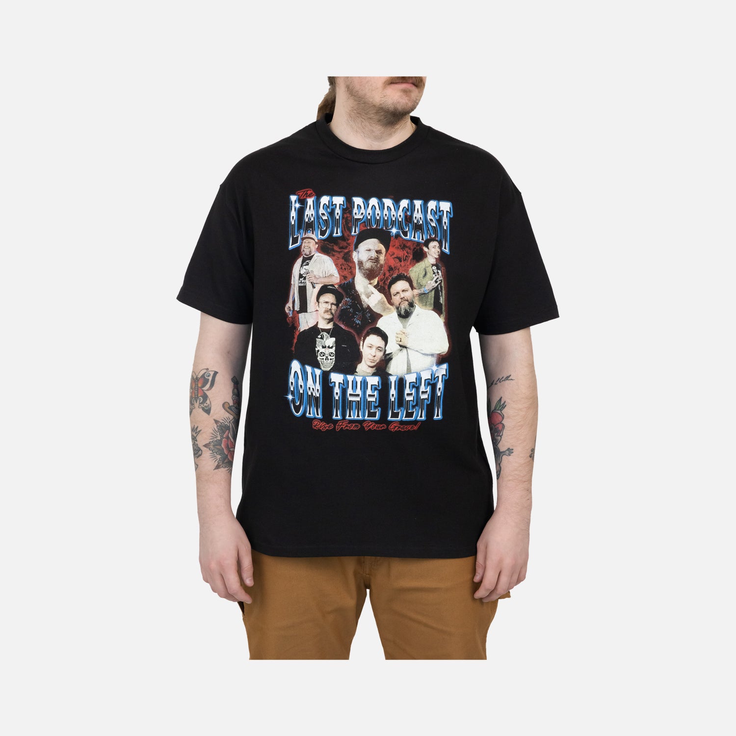 Black tee on male model with graphic of the hosts with blue and red text "THE LAST PODCAST ON THE LEFT RISE FROM YOUR GRAVE"