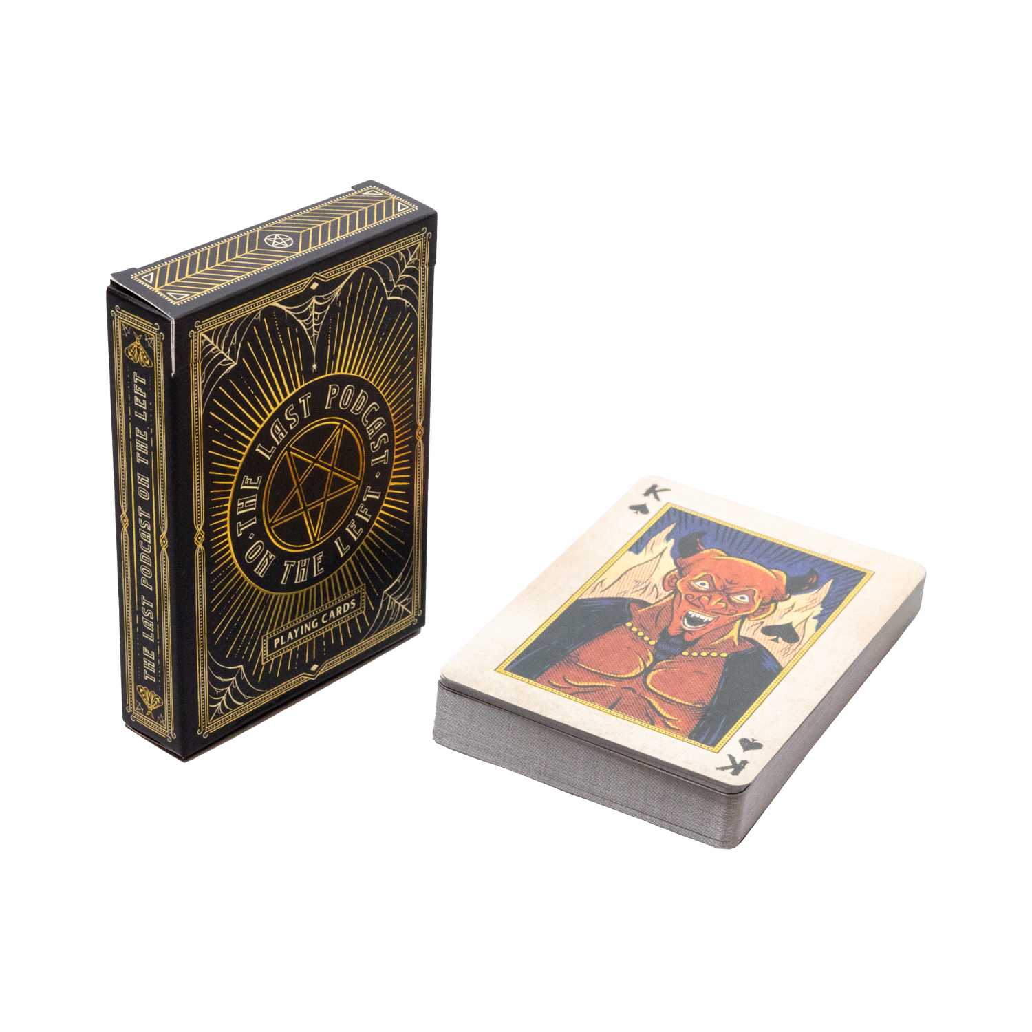 Playing card deck with a black and gold box and a card featuring a devil graphic on a white background
