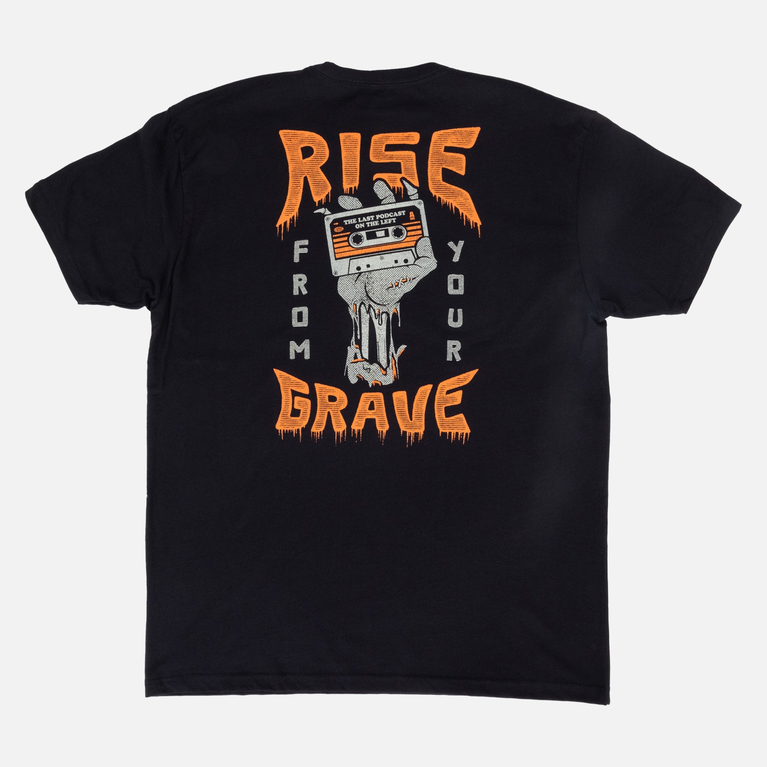 Rear view of black shirt with graphic of skeleton hand holding cassette with text "THE LAST PODCAST ON THE LEFT" surrounded by text "RISE FROM YOUR GRAVE"