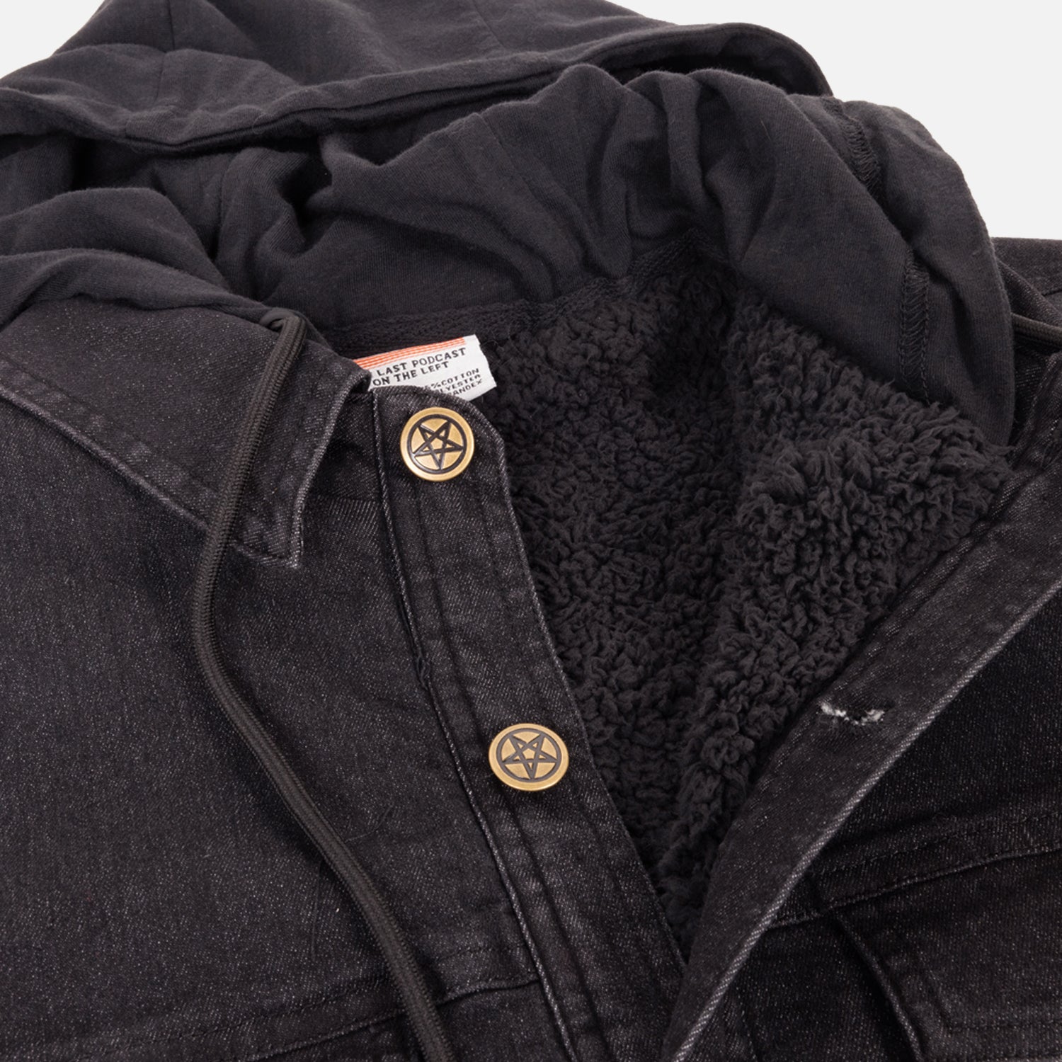 closeup of Black Vintage hooded denim jacket showing fleece lining and pentagram buttons