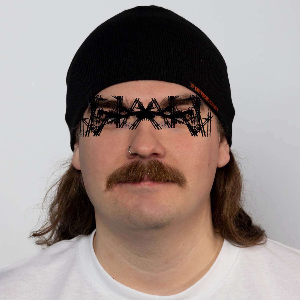 Person wearing a black beanie with orange text "THE LAST PODCAST ON THE LEFT"