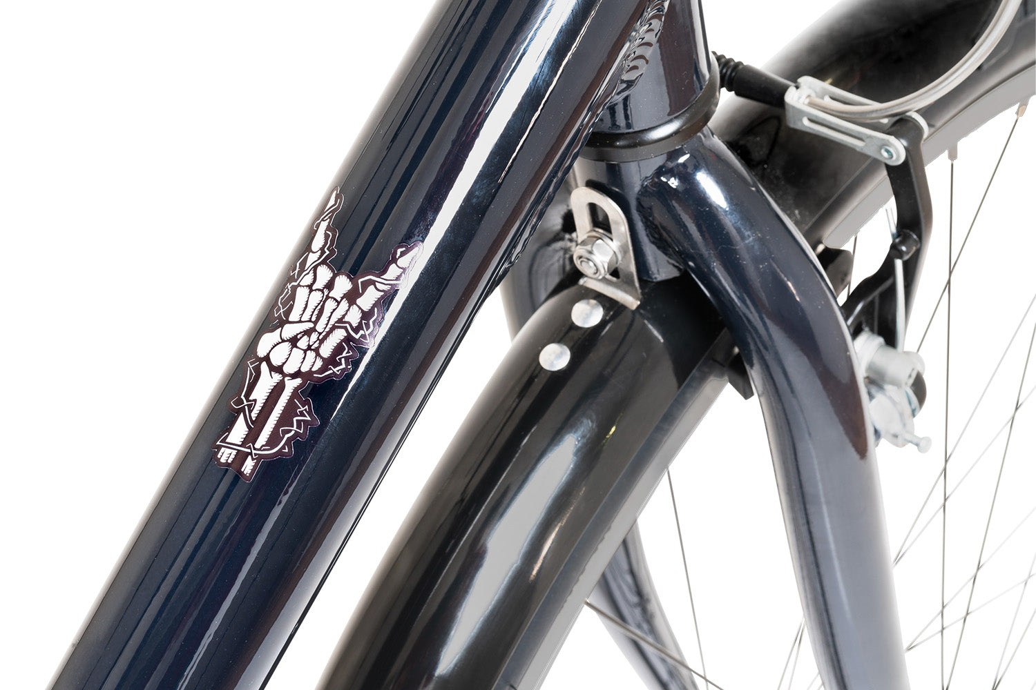 detail photo of top of top tube. skeleton hand in rock out gesture in white.