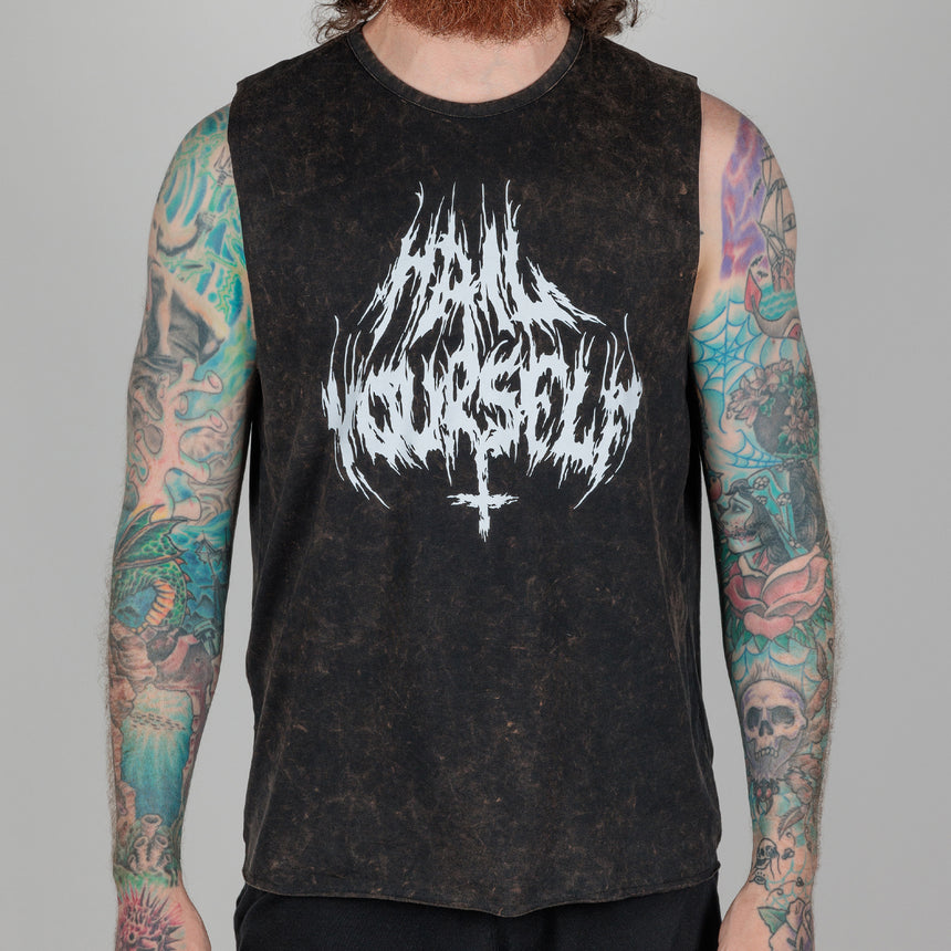photo of male model wearing brutal bleach washed sleeveless tee. " hail yourself!" printed in metal font on front. inverted cross extending from the r and s.