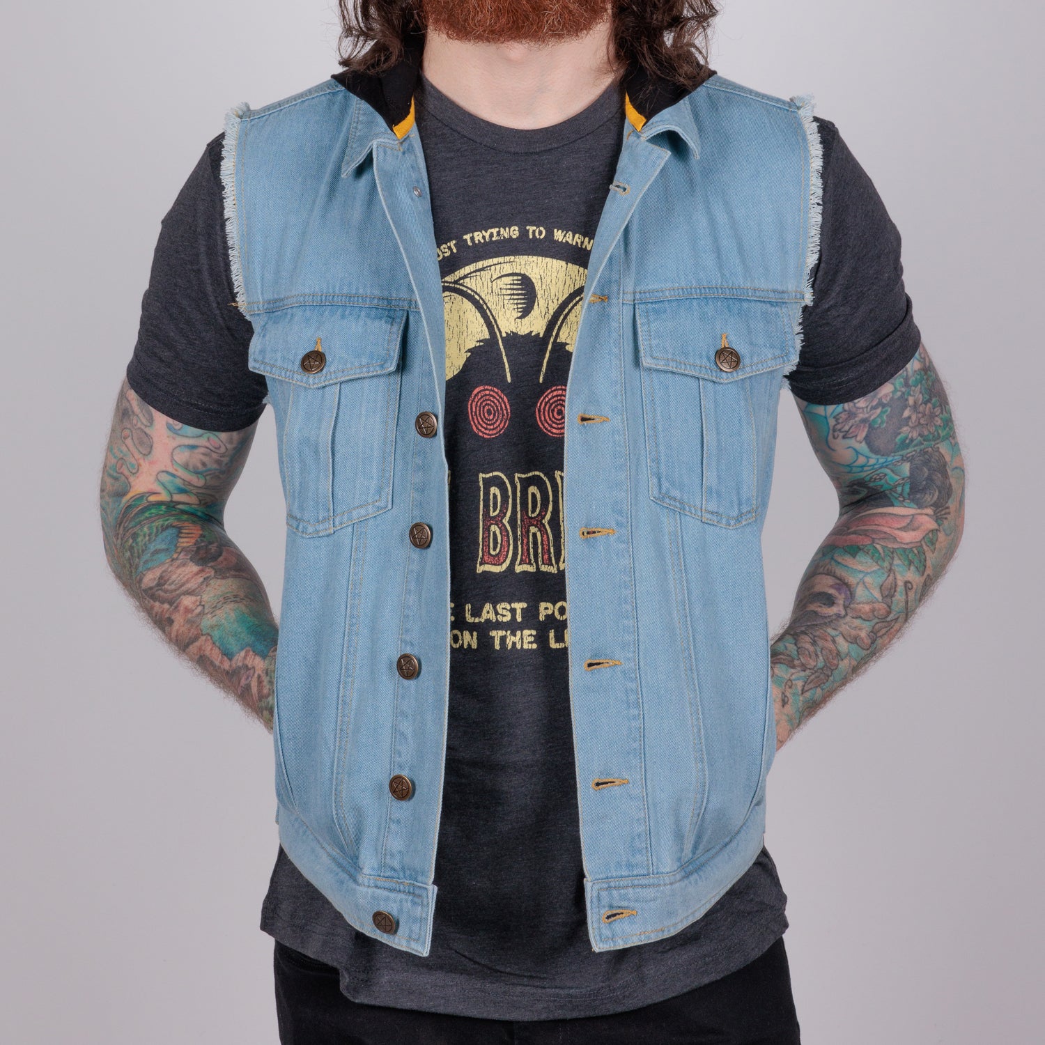 photo of male model wearing hooded denim vest