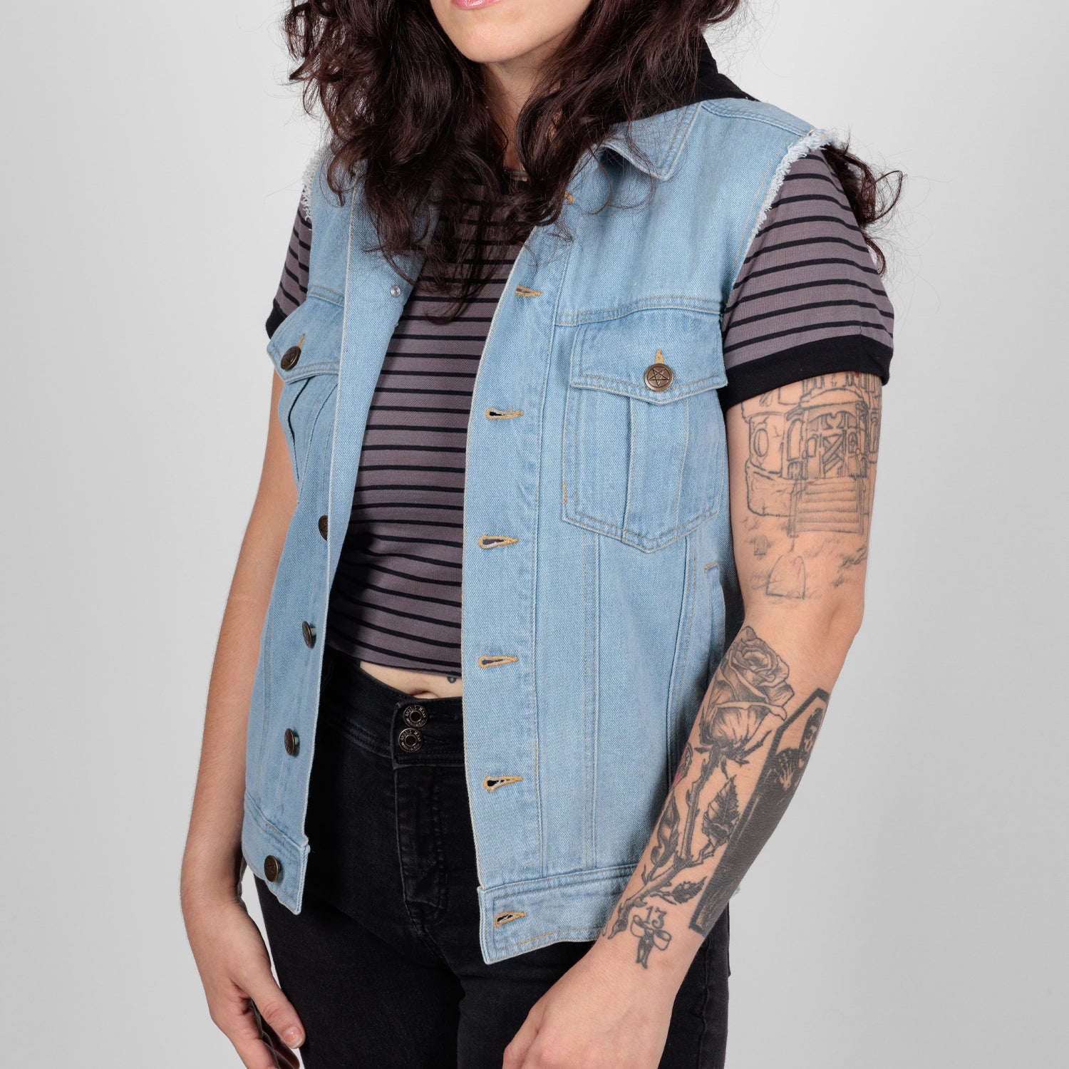 photo of female model wearing hooded denim vest