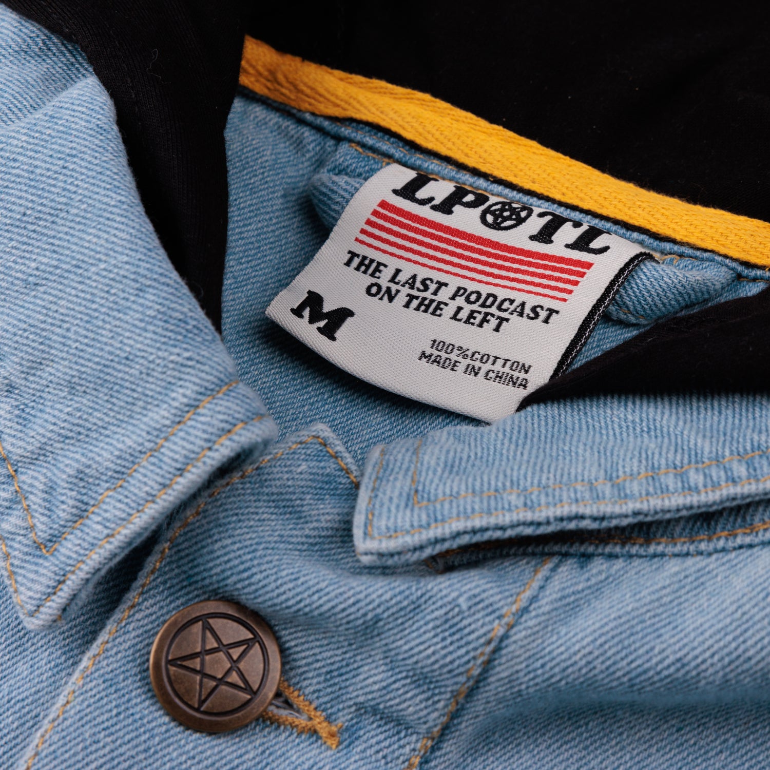 detail photo of neck label and yellow piping on neck  interior