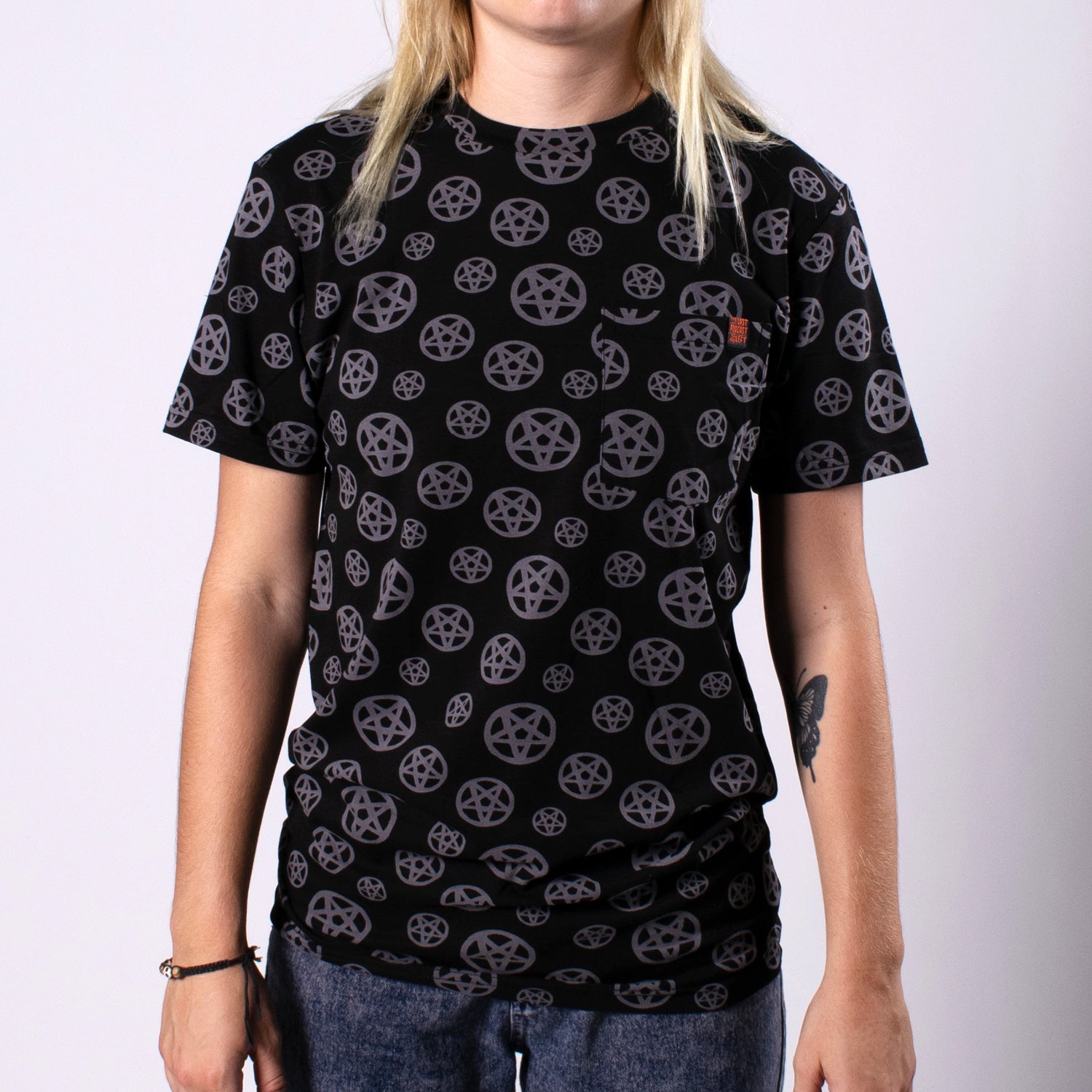 woman in black pocket shirt with pentagram print