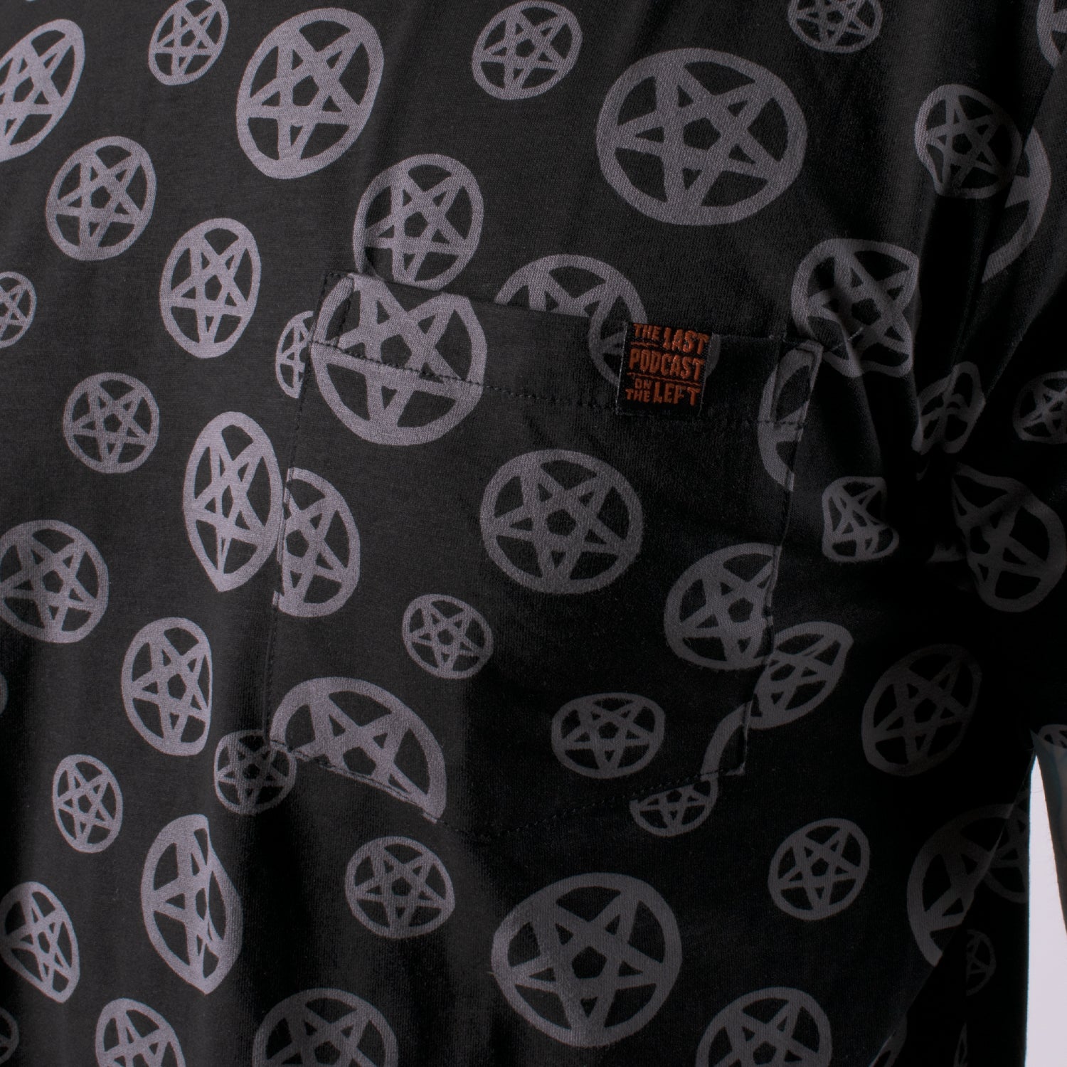 closeup of pocket on black shirt with pentagram print