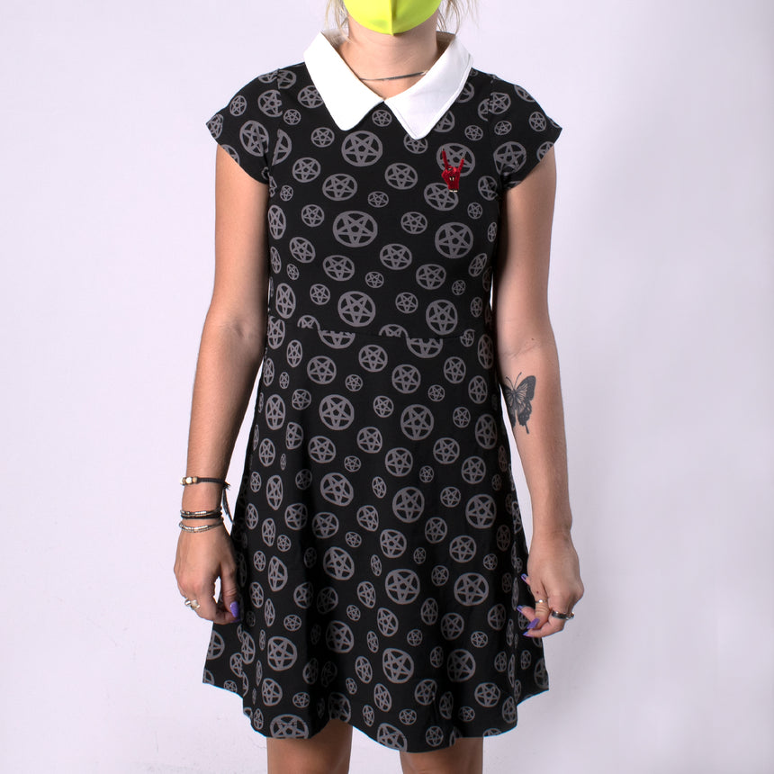 woman in black dress with white color with pentagram print