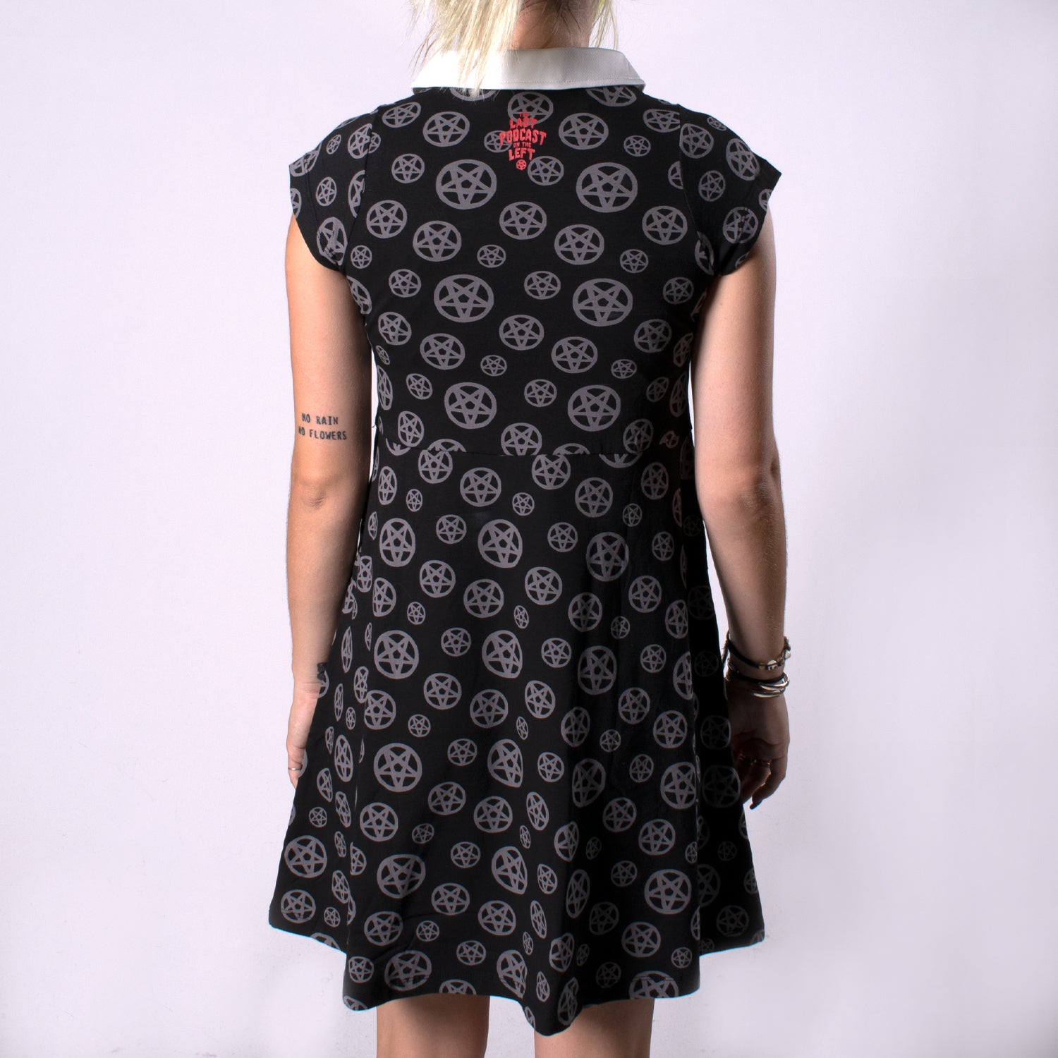 back view of woman in pentagram dress with pentagram print