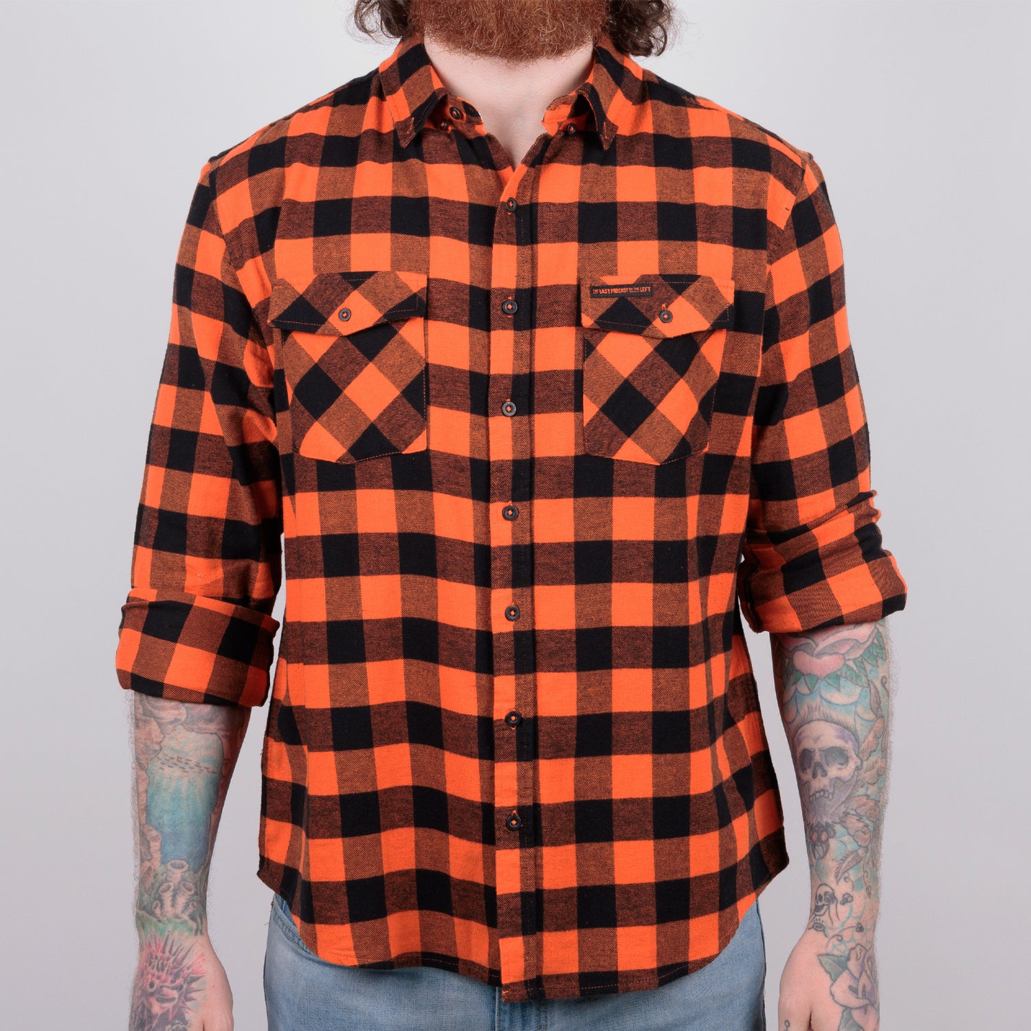 Man in orange/black flannel buttondown