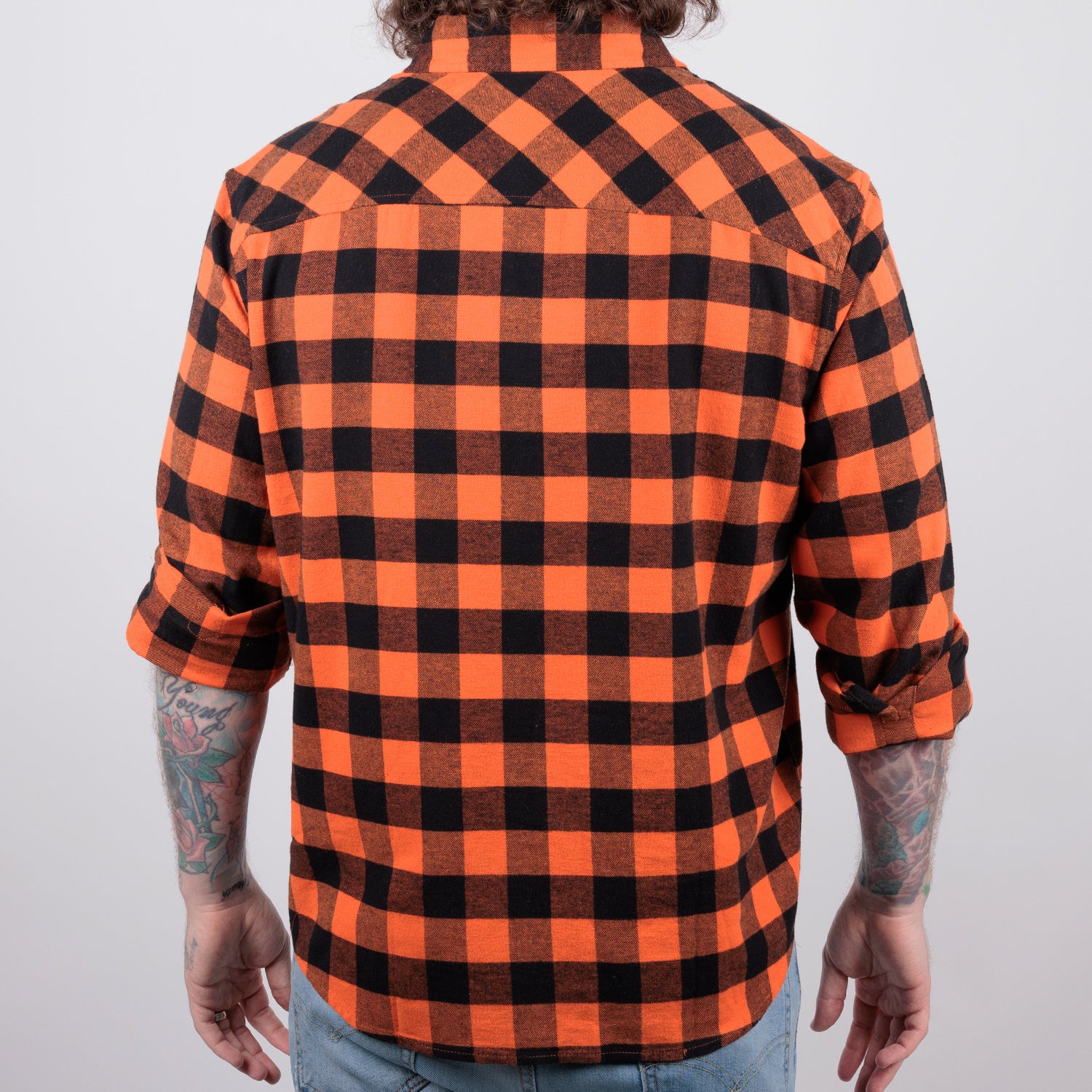 back of man in orange/black flannel buttondown