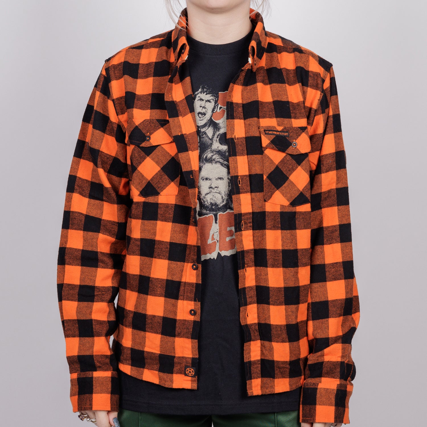 woman in orange/black flannel buttondown