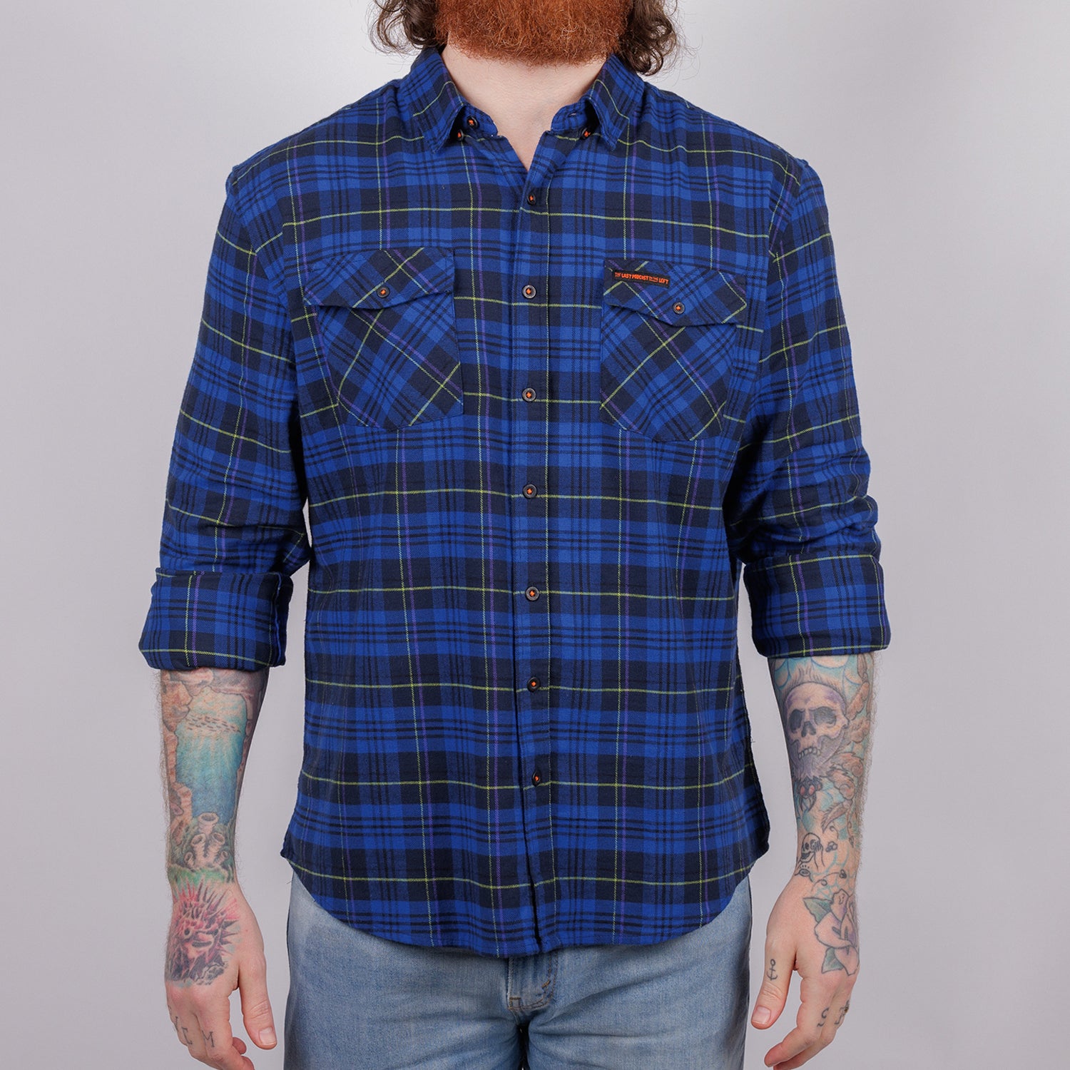 man in blue plaid flannel buttondown