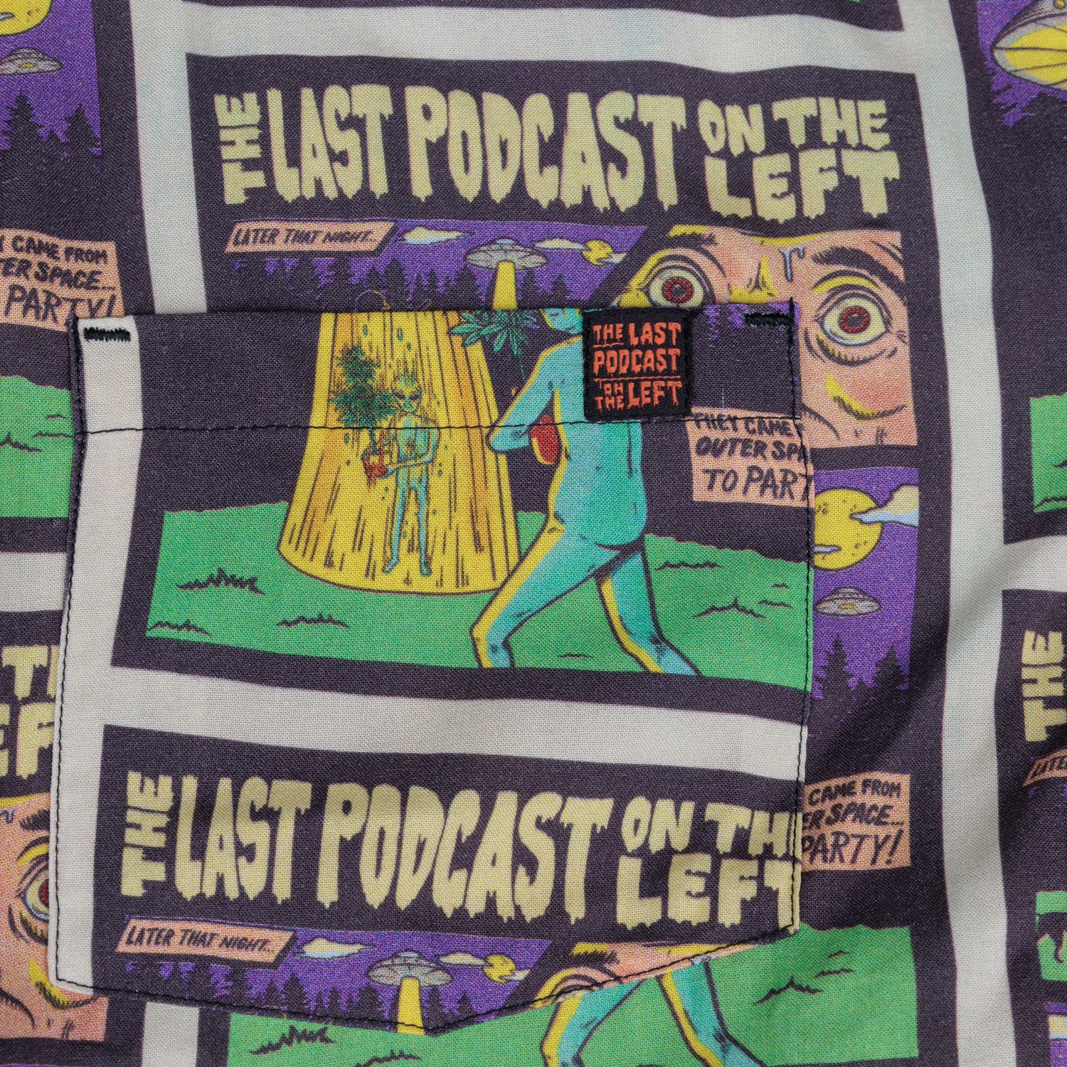 detail photo of pocket with tag sewn onto top in black. last podcast on the left  in orange