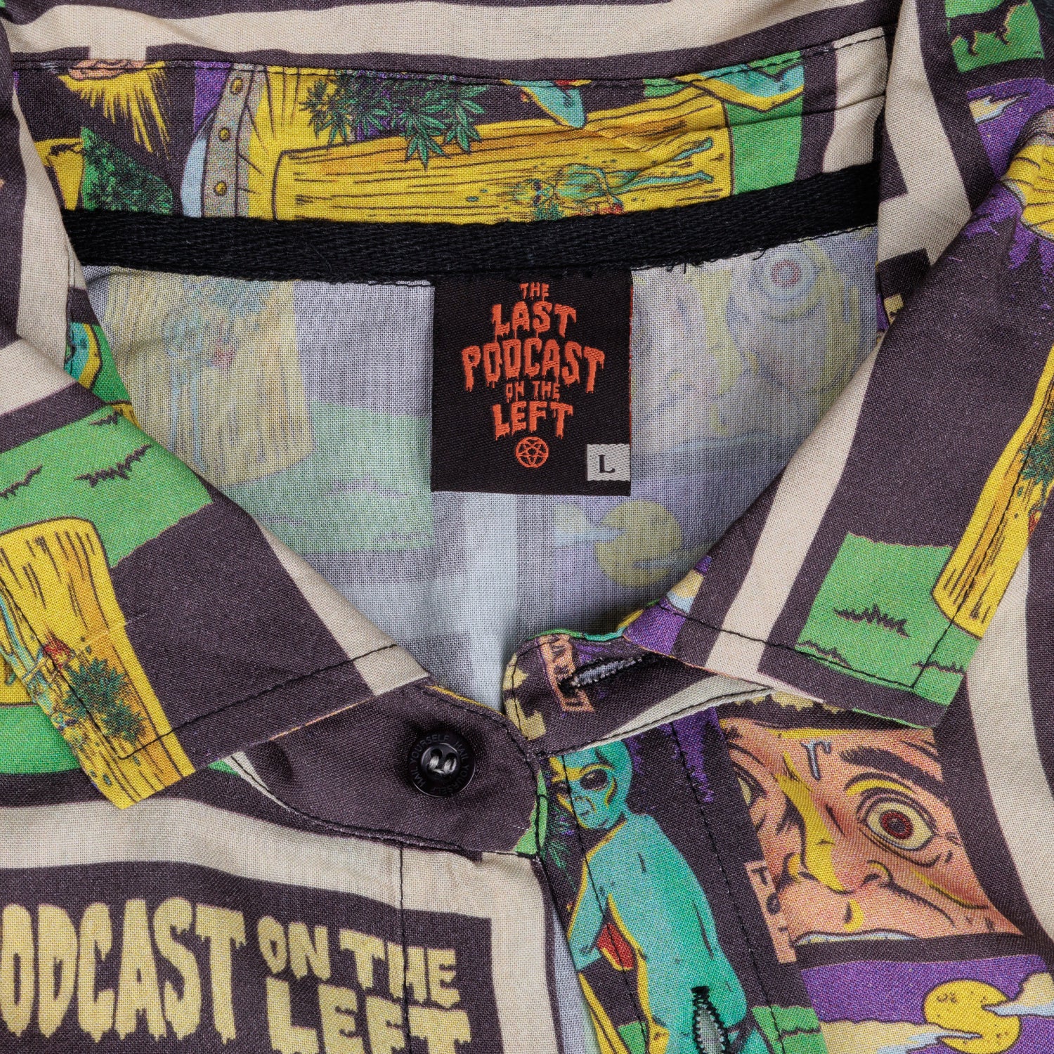detail photo of neck tag sewn in black. last podcast on the left in orange