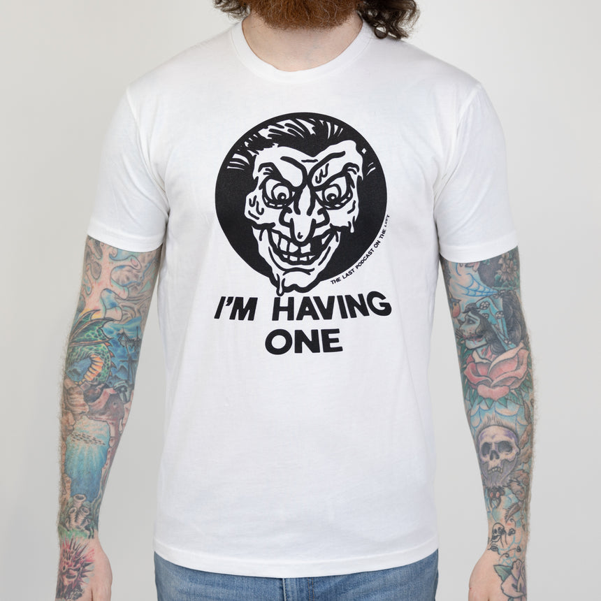 man in white shirt with black graphic of melting face with large black text below "I'M HAVING ONE" and small text on lower left of graphic "THE LAST PODCAST ON THE LEFT"