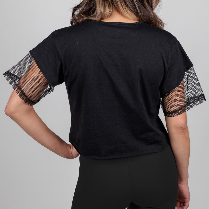 photo of female model wearing black crop top with mesh sleeves. worn smiley face with horns in red with "hail yourself!" printed underneath in the same color.