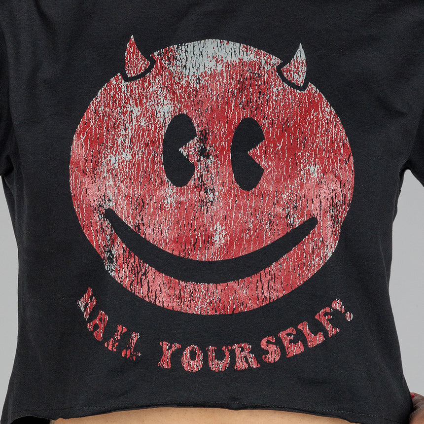 photo of female model wearing black crop top with mesh sleeves. worn smiley face with horns in red with "hail yourself!" printed underneath in the same color.