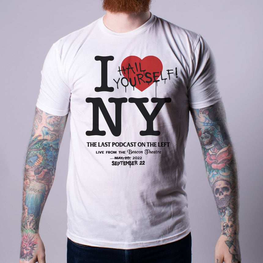 Man in white shirt with "I Heart NY" text with "Hail Yourself!" over the heart. Additional text below "THE LAST PODCAST ON THE LEFT LIVE FROM THE Beacon Theatre MAY 20, 2022 SEPTEMBER 22" with a strikethrough through "MAY 20"